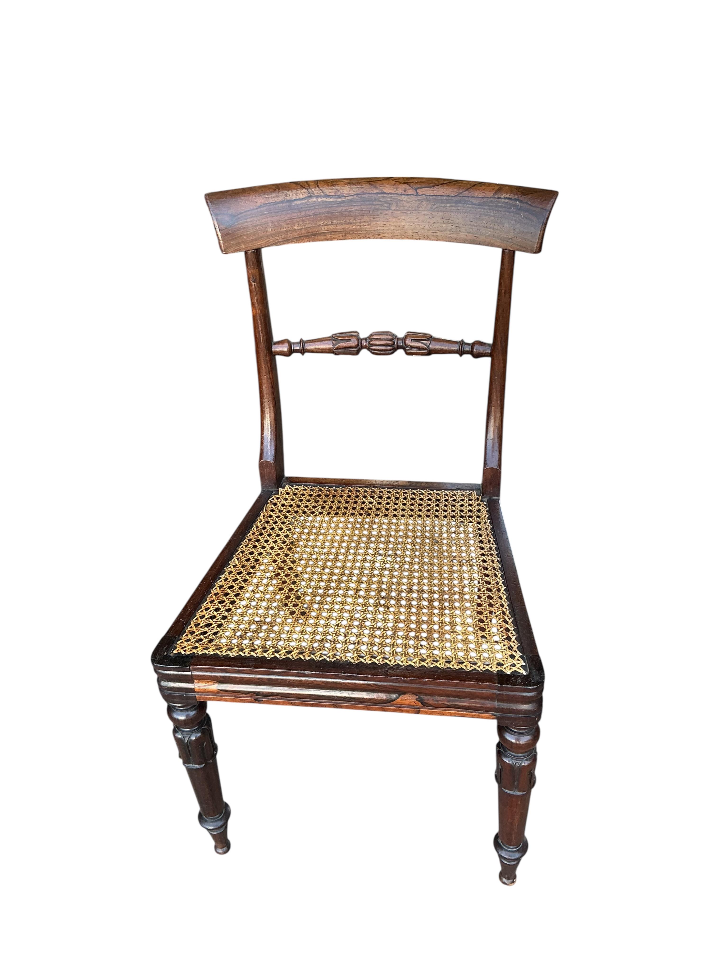 A pair of William IV rosewood bar back dining chairs with caned seats, width 46cm, depth 40cm, height 84cm